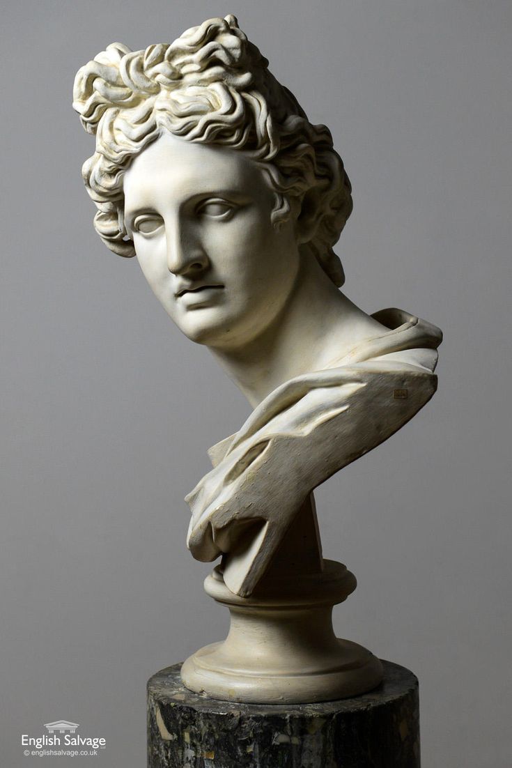 a white marble busturine with curly hair