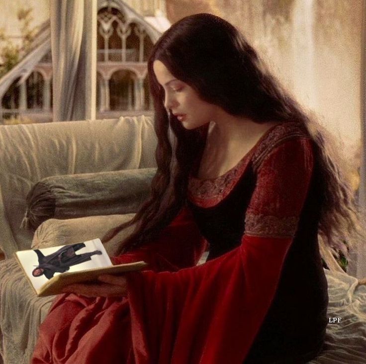 a woman sitting on a couch reading a book