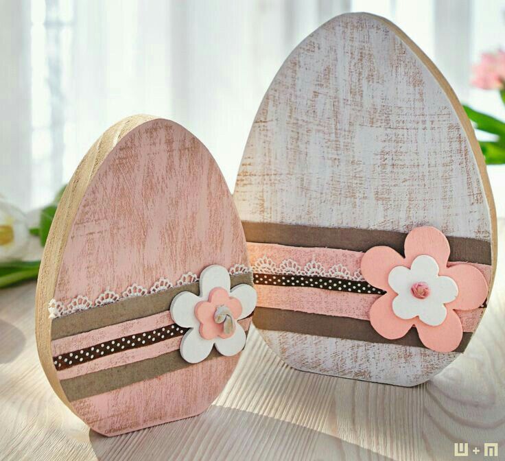 two wooden heart shaped boxes with flowers on them