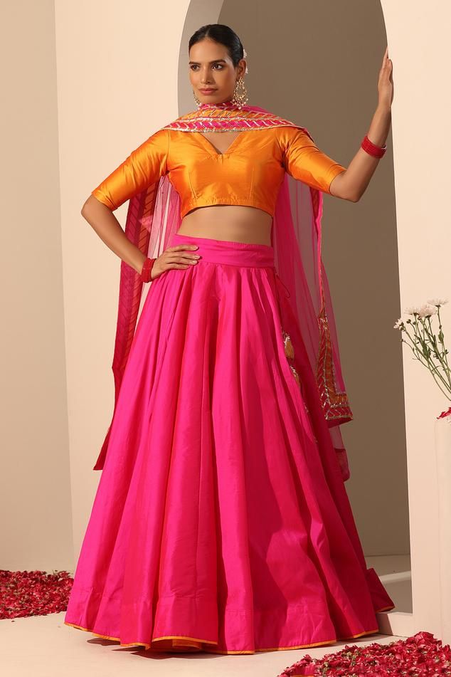 Hot pink solid lehenga crafted in tafetta silk with statement tassels. Paired with a blouse and gota lace bordered dupatta.
Components: 3
Pattern: Embroidered
Type Of Work: Gota lace
Neckline: V Neck
Sleeve Type: Elbow
Fabric: Lehenga and Blouse: Tafetta Silk, Dupatta: Soft Net
Color: Pink
Other Details: 
Length:
Lehenga: 40 inches
Dupatta: 2.5 mtrs
Dupatta width: 44 inches
Occasion: Mehendi and Haldi - Aza Fashions Festive Pink Sharara With Tassels, Traditional Anarkali Set With Tassels, Navratri Anarkali Set With Tassels, Festive Pink Tassel Sharara, Traditional Anarkali Set With Tassels For Diwali, Bollywood Anarkali Set With Tassels For Festive Occasions, Festive Bollywood Anarkali Set With Tassels, Traditional Anarkali Set With Tassels For Navratri, Bollywood Style Festive Anarkali Set With Tassels