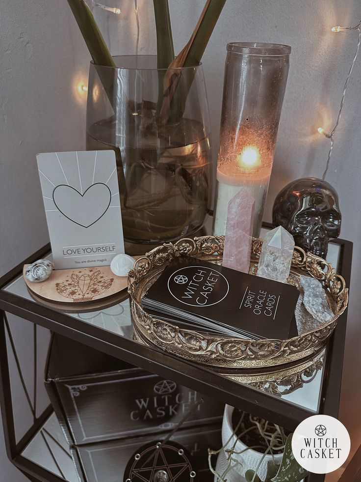 a table with candles, cards and other items on it