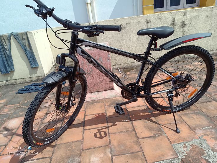 a bicycle parked on the side of a building