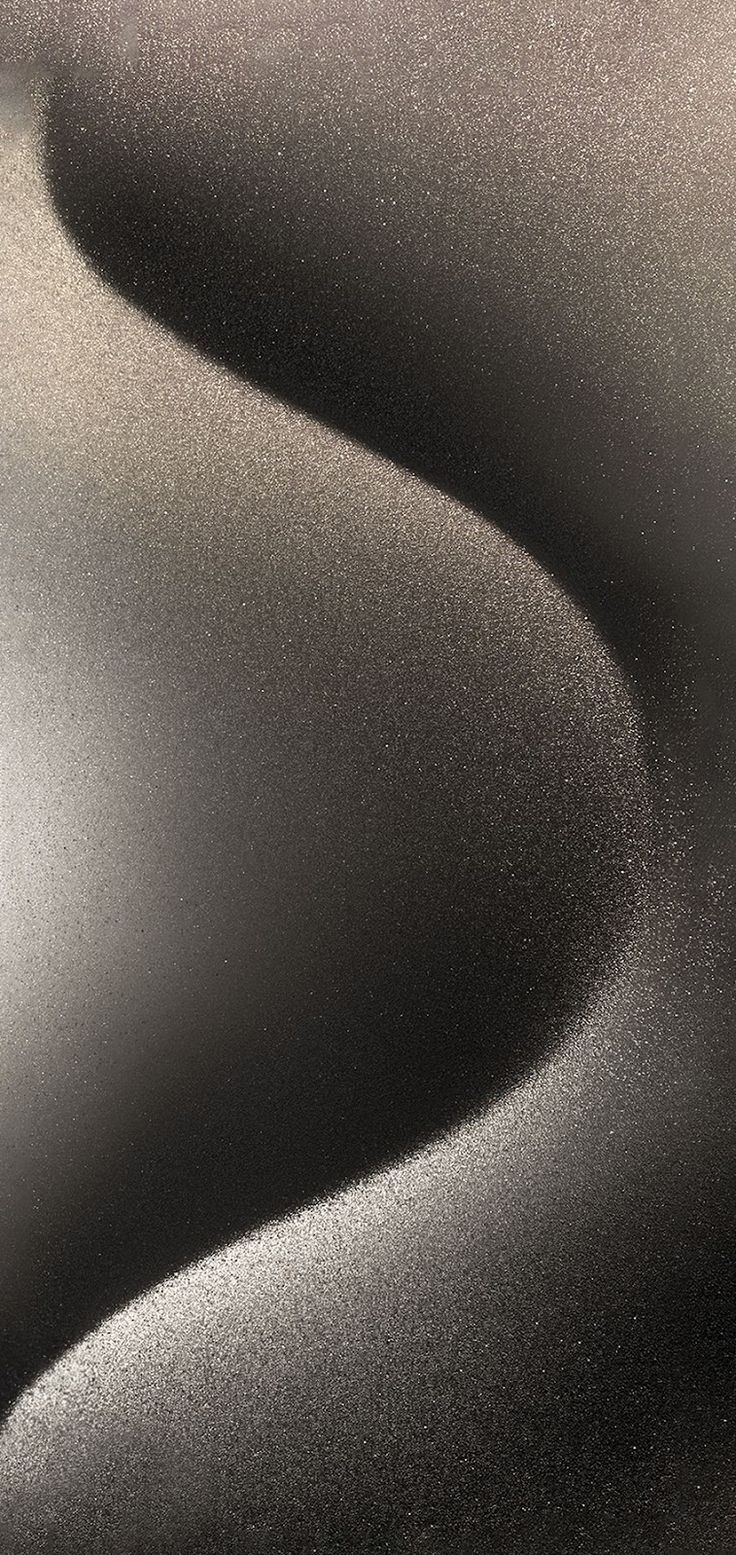 a black and white photo of the surface of a sand dune, taken from above