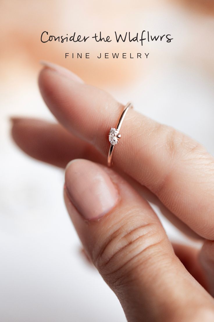 This "toi et moi" ring features a petite round brilliant and pear diamond off-set on a dainty golden band. The Two Stone Pear Cluster Stacker is sure to sparkle in your stack! Minimalist Round Diamond Wedding Ring, Minimalist Diamond Wedding Ring, Dainty Diamond Ring With Single Cut Diamonds, Single Diamond Open Ring For Promise, Delicate Diamond Ring With Round Band, Minimalist Open Diamond Ring In Diamond White, Minimalist Diamond White Open Diamond Ring, Delicate Round Cut Diamond Ring For Promise, Delicate Round Cut Diamond Promise Ring