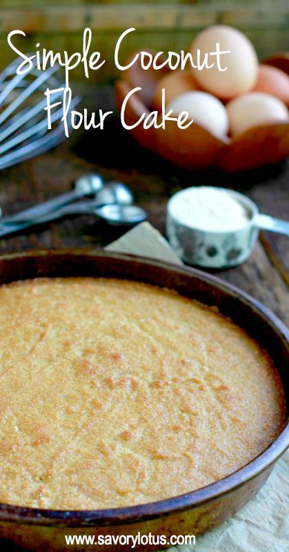 a baked cake in a pan on a table with silverware and spoons next to it