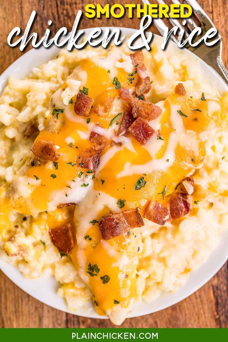 a white plate topped with mashed potatoes covered in cheesy bacon and cheese