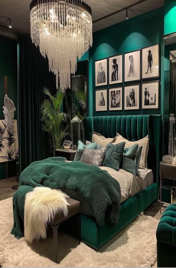 a bedroom with green walls and pictures on the wall