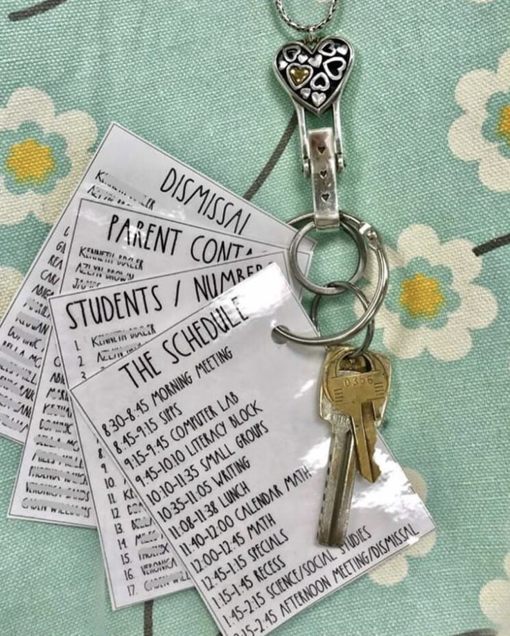 two keys are attached to a keychain on a flowered cloth with the words disarrayment com and student's / number