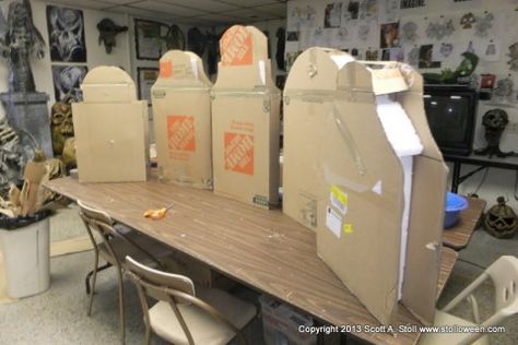 several cardboard boxes sitting on top of a wooden table