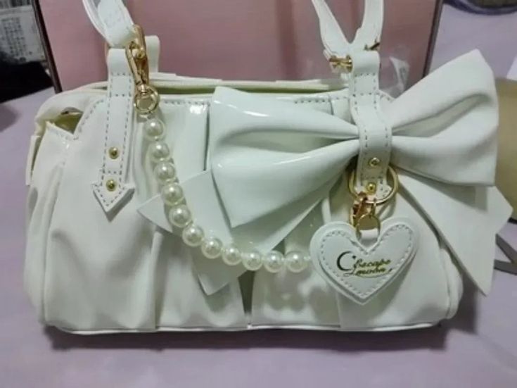 Length: 23cm width:7 cm height :13 cm 1cm=0.39 inch White Handheld Shoulder Bag For School, White Party Satchel Bag, White Satchel Shoulder Bag With Mobile Phone Bag, White Satchel Shoulder Bag For Party, White Satchel Bag With Pearl Handle, White Bags With Pearl Handle For Daily Use, White Shoulder Bag For Party, White Satchel With Pearl Handle, Trendy White Shoulder Bag With Pearl Handle