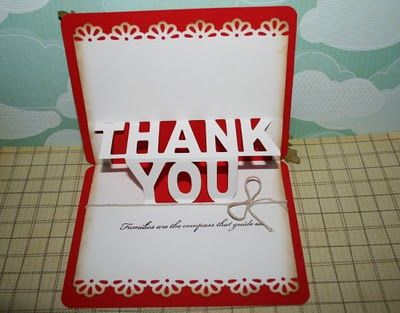 a thank you card in a red and white box