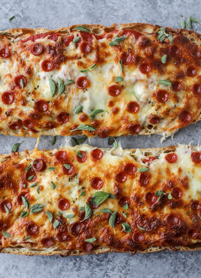 two slices of pizza sitting on top of a table