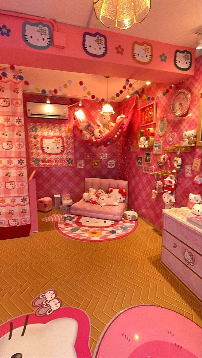 a hello kitty themed bedroom with pink walls