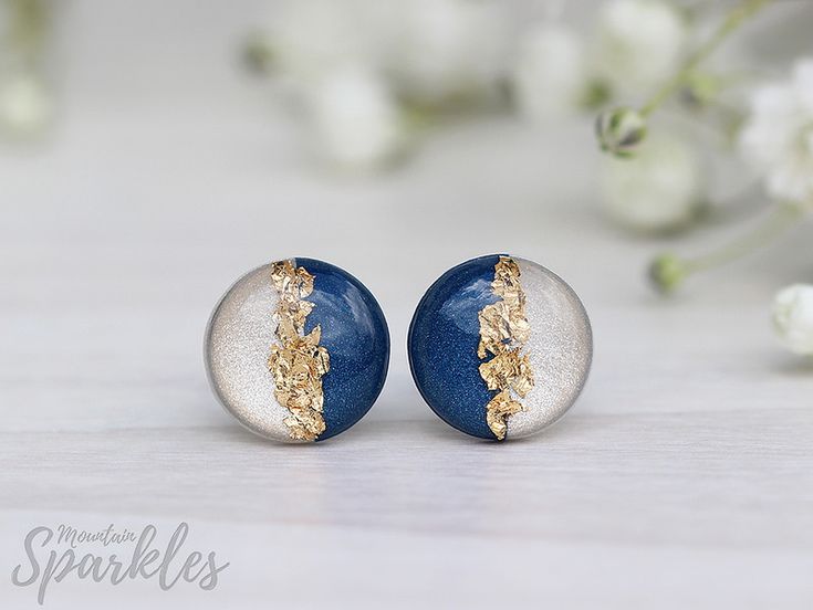 two tone gold and silver earrings with blue marble