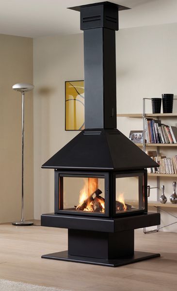 a large black fireplace in a living room