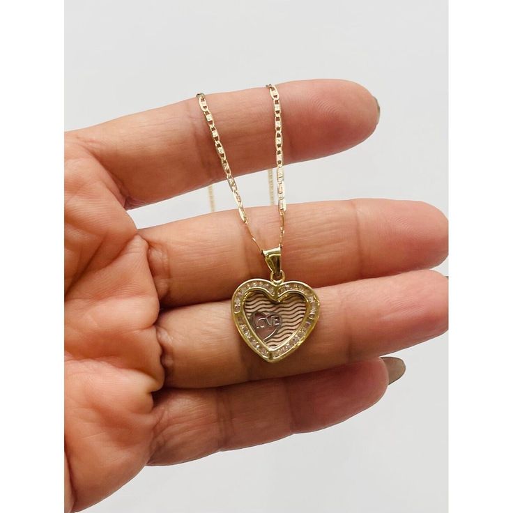 10k gold pendant and necklace heart love ❤️ 18mm long pendant ❤️ Pendant in yellow gold with white cubic zirconia ❤️ Necklace is 18” long and 2 millimeters ❤️ Fine jewelry Checkout my other jewelry ❤️ Dije y cadena colgante de oro de 10kilates ❤️ Corazón de mujer mide 18 milimetros ❤️ Cadena mide 18 pulgadas de larga y 2 milímetros de ancha ❤️ Dije Piedra zirconia Blanca SKU 012034 Zirconia Necklace, Necklace Love, Cubic Zirconia Necklace, Necklace Heart, Long Pendant, Heart Love, 10k Gold, Heart Necklace, Gold Pendant