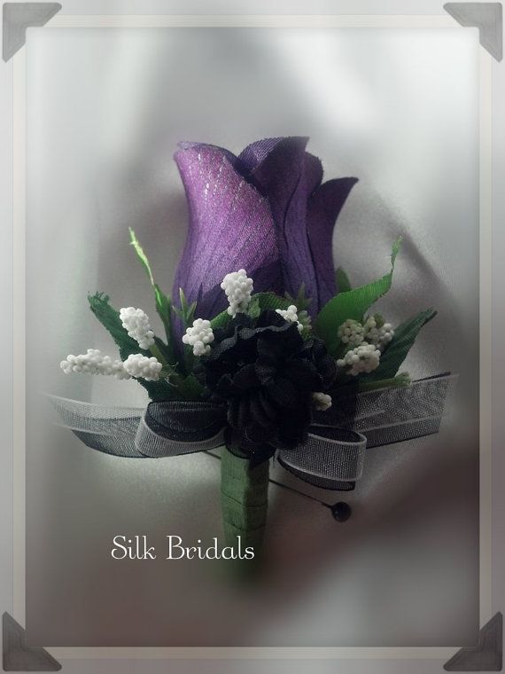 a purple flower bouquet with white flowers and greenery