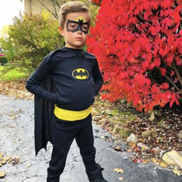 a little boy dressed up as batman for halloween