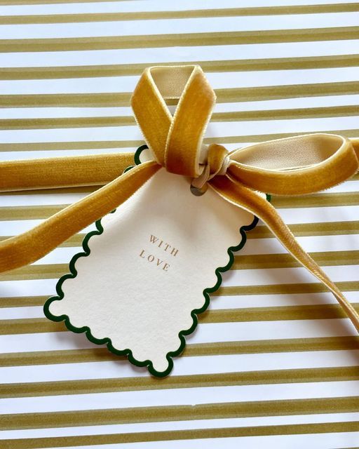 a gift tag tied with a yellow ribbon