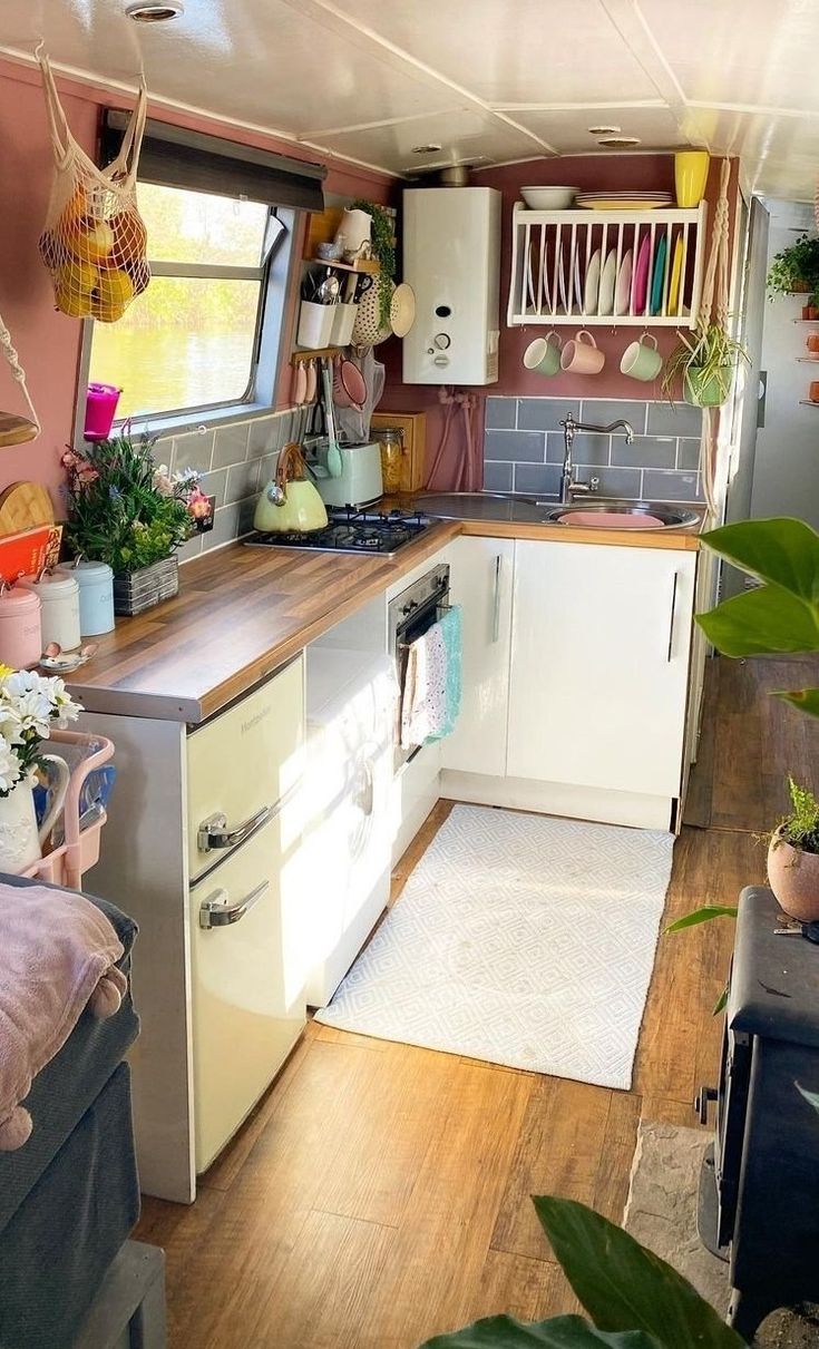 a kitchen with lots of plants in it