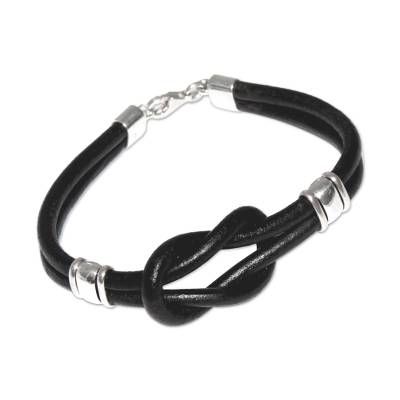 Black and silver are forever tied together in the design of this bracelet by Jose Antonio Ibeibarriaga. The leather bracelet is crafted by hand and accentuated with high polished sterling silver. .925 Sterling silver Modern Black Leather Bracelet, Modern Black Leather Bracelet With Sterling Silver, Black Sterling Silver Friendship Bracelets, Black Sterling Silver Bracelets For Friendship, Black Leather Bracelets With Sterling Silver Clasp, Leather Bracelet With Sterling Silver Clasp For Gift, Elegant Black Leather Bracelet With Sterling Silver, Elegant Black Leather Bracelet In Sterling Silver, Adjustable Black Leather Bracelet With Sterling Silver Clasp