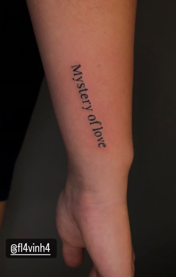 a person with a tattoo on their arm that says, mystery is not trues