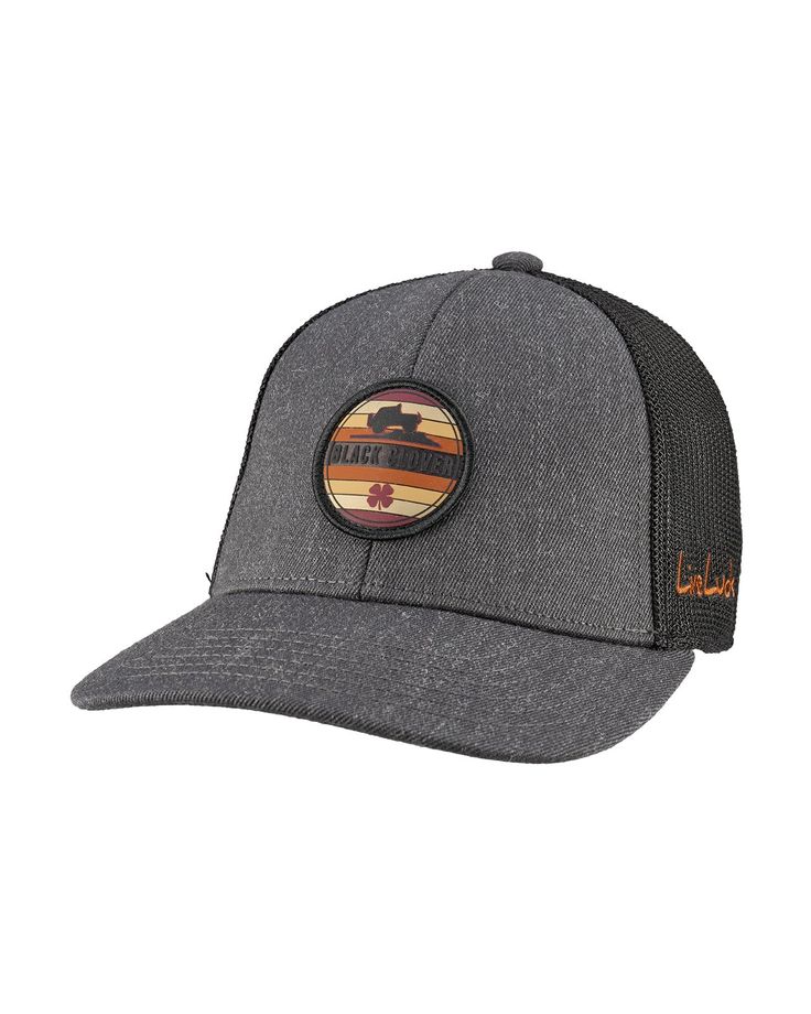 a grey hat with an orange and black patch on the front