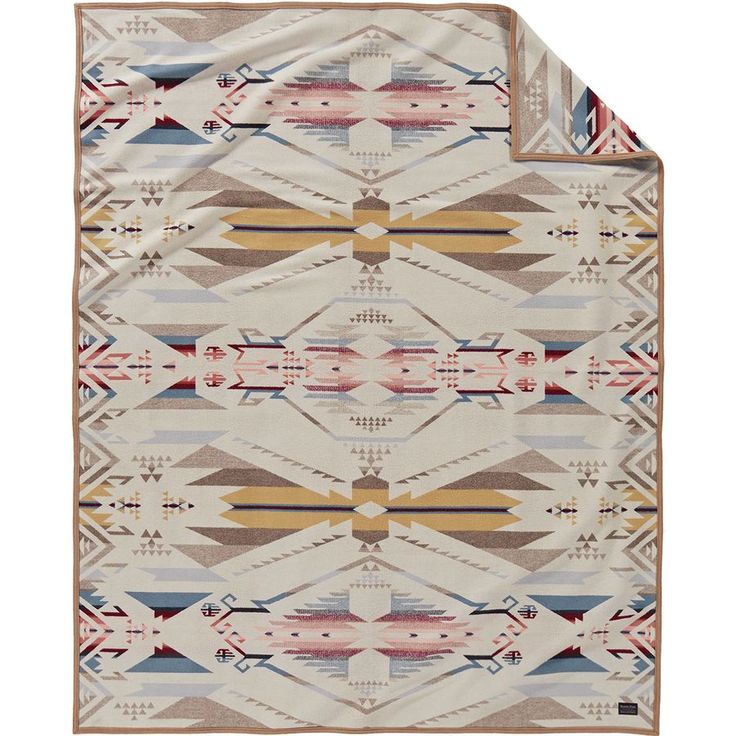 a blanket with an abstract design on the front and back side, in beige tones