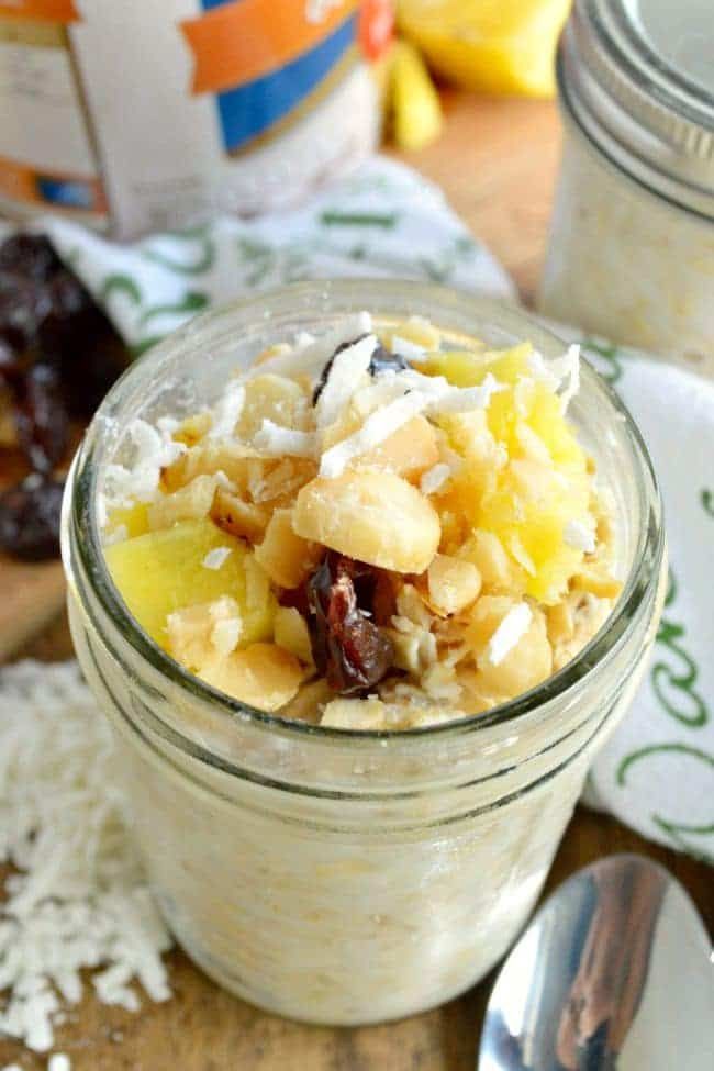 a glass jar filled with oatmeal sitting on top of a wooden table