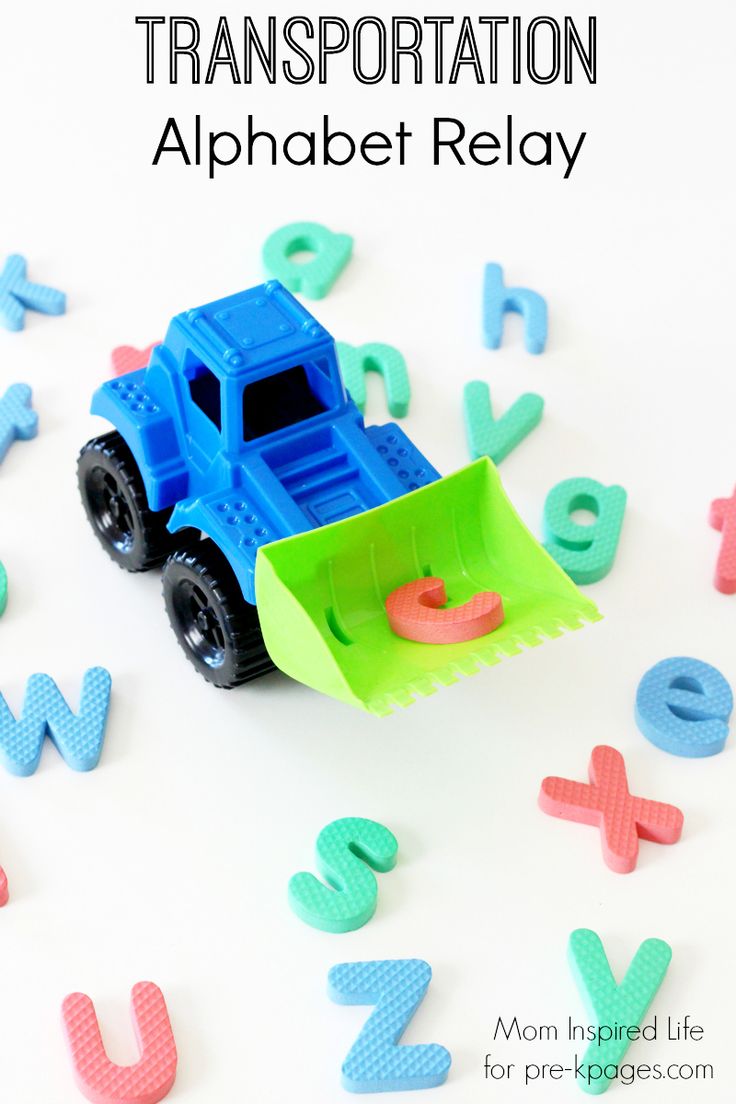 a blue and green toy truck surrounded by letters on a white surface with the words transportation alphabet relay