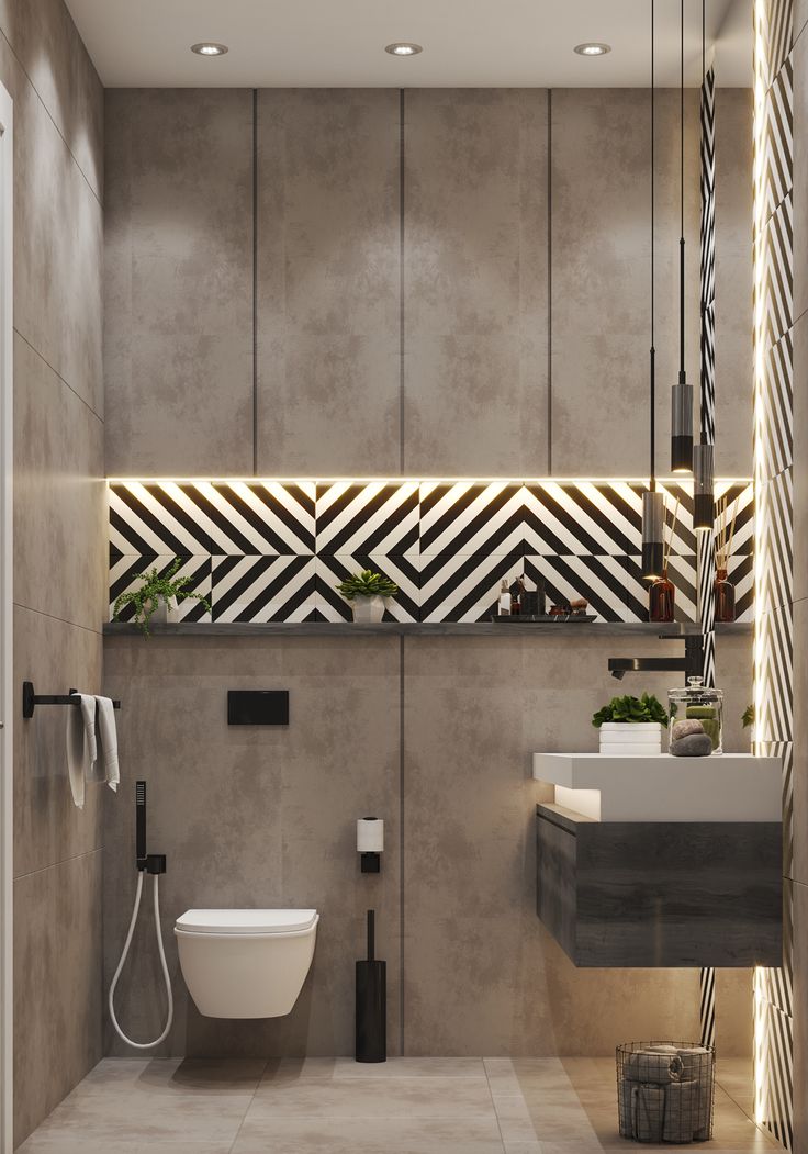 a modern bathroom with a toilet, sink and shower in the corner is lit by recessed lights