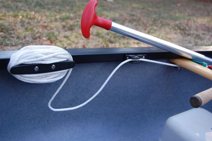 a baseball bat and ball sitting on the back of a truck with its handle up