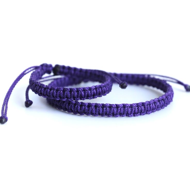 "These lovely braided bracelets are perfect for any occasion. Choose from the options the Father and Son bracelet set, the adult's bracelet or the kid's bracelet. The kid's bracelet closes to 4.5\" and the adult's bracelet closes to 6.5\". Both bracelets are adjustable." Casual Braided Beaded Bracelets As Gift, Casual Braided Beaded Bracelets For Gift, Purple Bracelets With Adjustable Cord, Adjustable Purple Bracelet With Cord, Adjustable Purple Bracelets For Gifts, Adjustable Purple Bracelet Gift, Adjustable Purple Bracelets As A Gift, Adjustable Purple Bracelet For Gift, Purple Adjustable Cord Bracelets