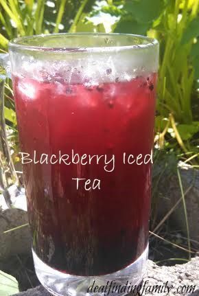 a glass mug filled with blackberry iced tea