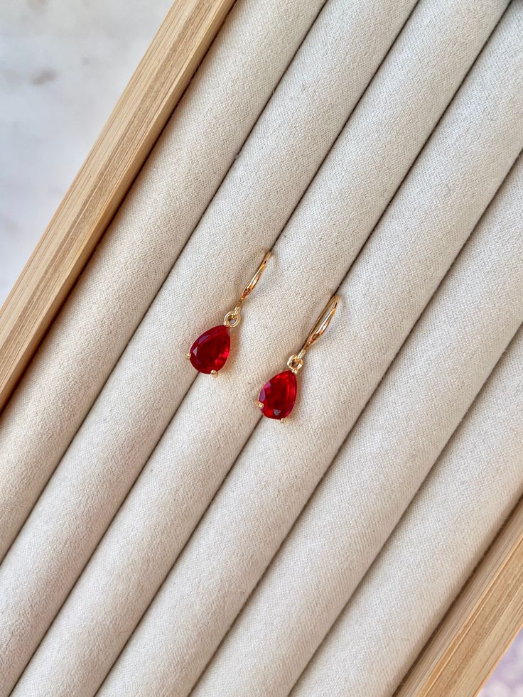 FREE DELIVERY WHEN YOU PURCHASE TWO OR MORE ITEMS <3  14k gold plated hooks  Ruby red (darker) or raspberry red (pinky) teardrop glass gemstone Ruby Earrings Dangling, Gold Ruby Teardrop Jewelry, Gold Ruby Earrings, Pierced, Red Gemstone Gold Plated Earrings, Red Gemstone Earrings In 14k Gold, Red Gemstone Gold-plated Earrings, Gold Sun, Ruby Earrings, Huggie Hoop Earrings