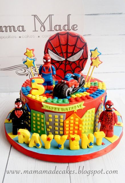 a spiderman themed birthday cake on a table