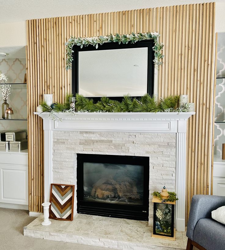 a living room with a fire place and a mirror on the fireplace mantels