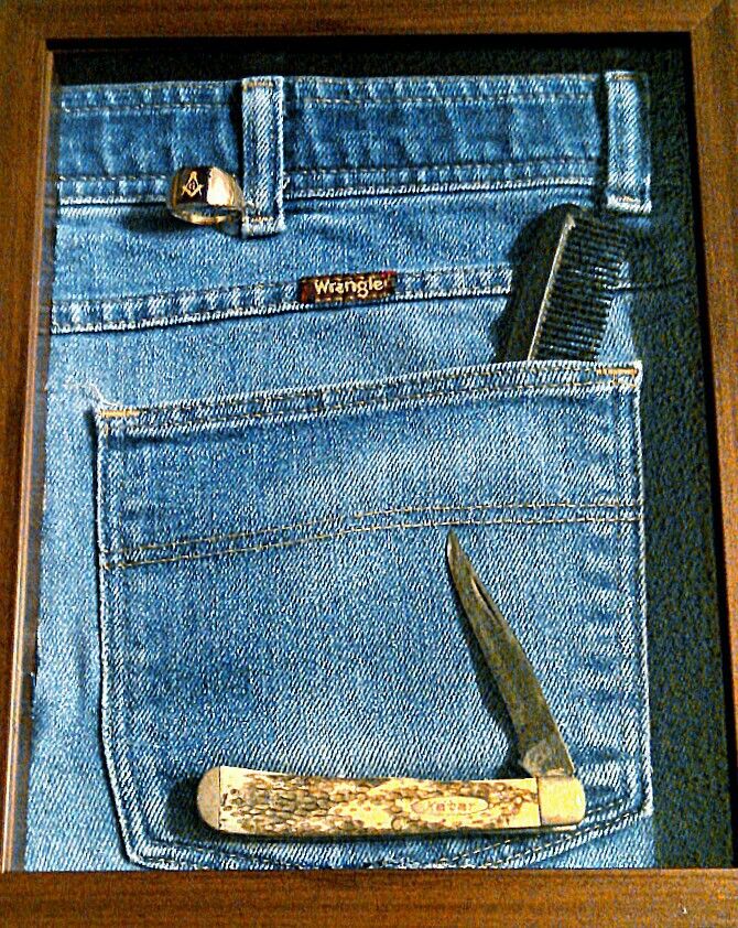 a pair of scissors and comb in a pocket