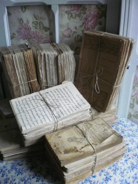 old books are stacked on top of each other