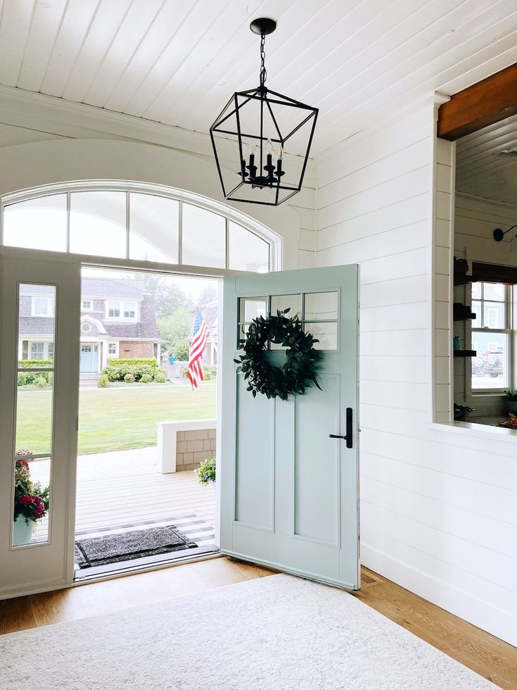 a white door with a wreath hanging from it's side and the words, door paint color - white blue benjamin moore / walls