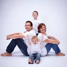 the family is posing for a photo together