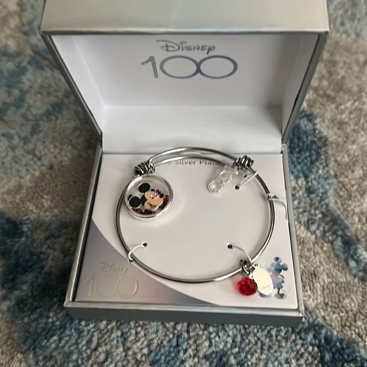 New In Box. Disney 100 Bracelet With Mickey Mouse Charm Red Stainless Steel Bracelet For Gift, Personalized Disney Silver Jewelry, Themed Silver Jewelry For Disney Fan Events, Disney Silver Bracelet Gift, Disney Silver Bracelet For A Gift, Silver Disney Bracelet For Gift, Silver Disney Bracelet As Gift, Disney Style Sterling Silver Jewelry Gift, Disney Silver Jewelry For Birthday