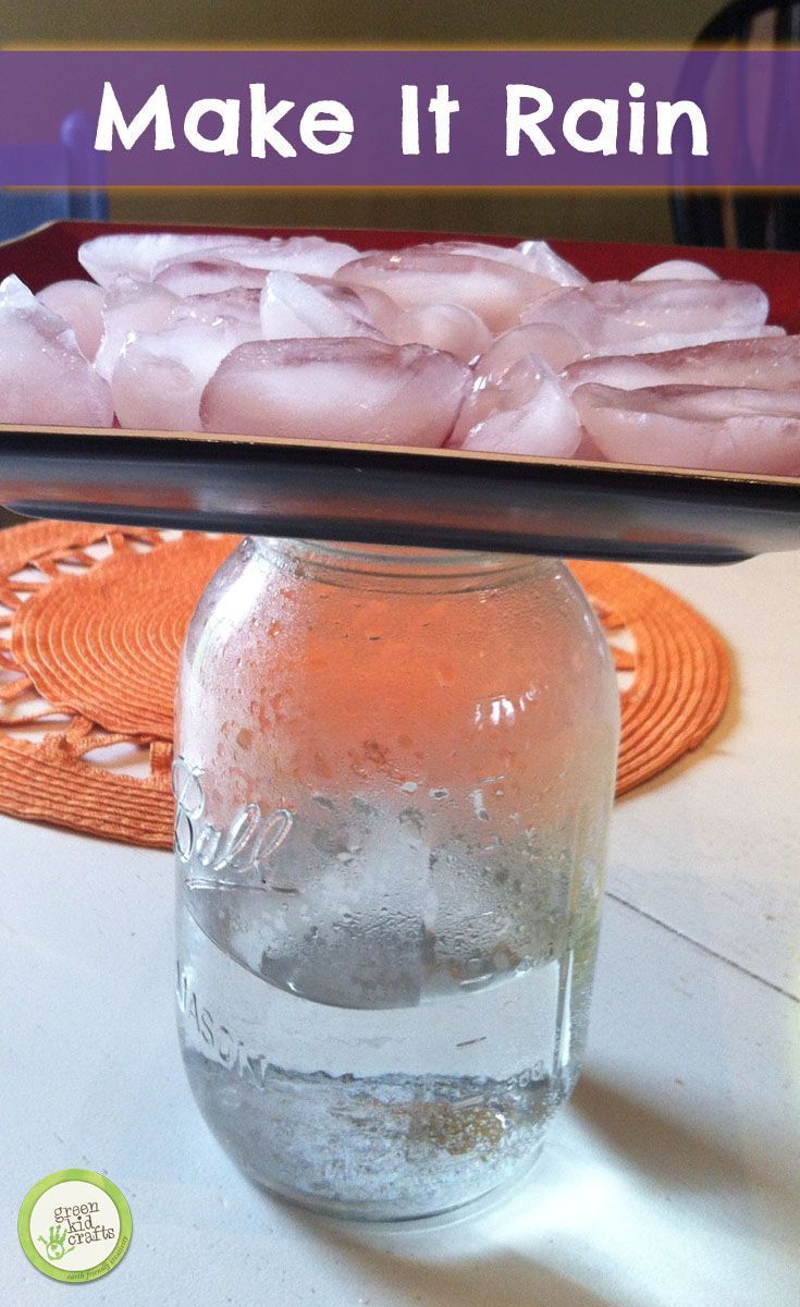 a glass jar filled with ice sitting on top of a table next to a tray