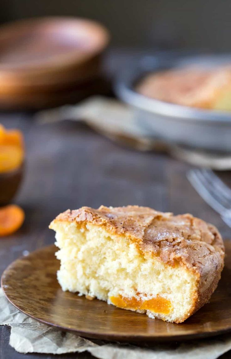 a piece of cake sitting on top of a wooden plate