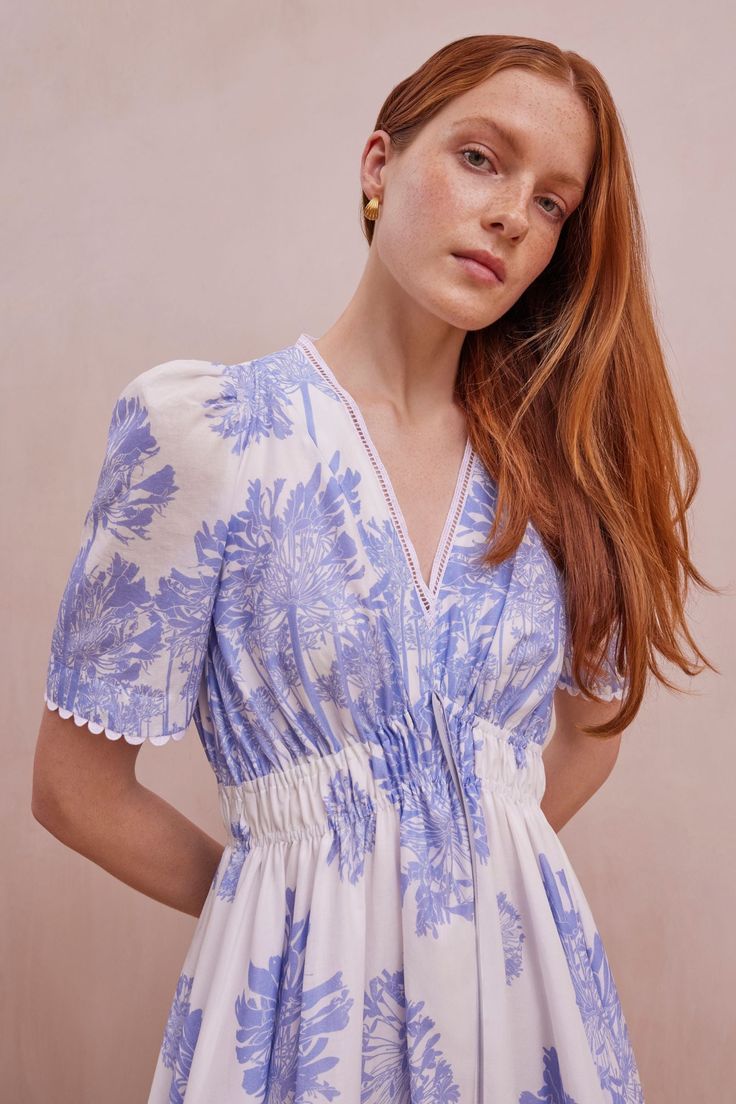 A brand-new silhouette for this season, the Lydia Dress in Agapanthus Cotton is a beautifully flattering midi dress with unique charm and versatility. Cut from a premium Italian BCI cotton cloth and printed with a stunning soft blue agapanthus printed floral design on a fresh white base. The agapanthus design originated from a beautiful lino print, designed by British artist Lydia Brenchley. We named the dress after her! Suzannah and the textile design team worked with Lydia’s original artistry Blue Agapanthus, Printed Kurti Designs, Chic Sunglasses, Boutique Couture, Fashion Designing, Printed Kurti, Formal Dresses Gowns, Printed Dresses, Printed Cotton Dress