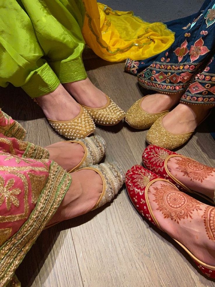 four women's feet with hennap on them in different colors and patterns