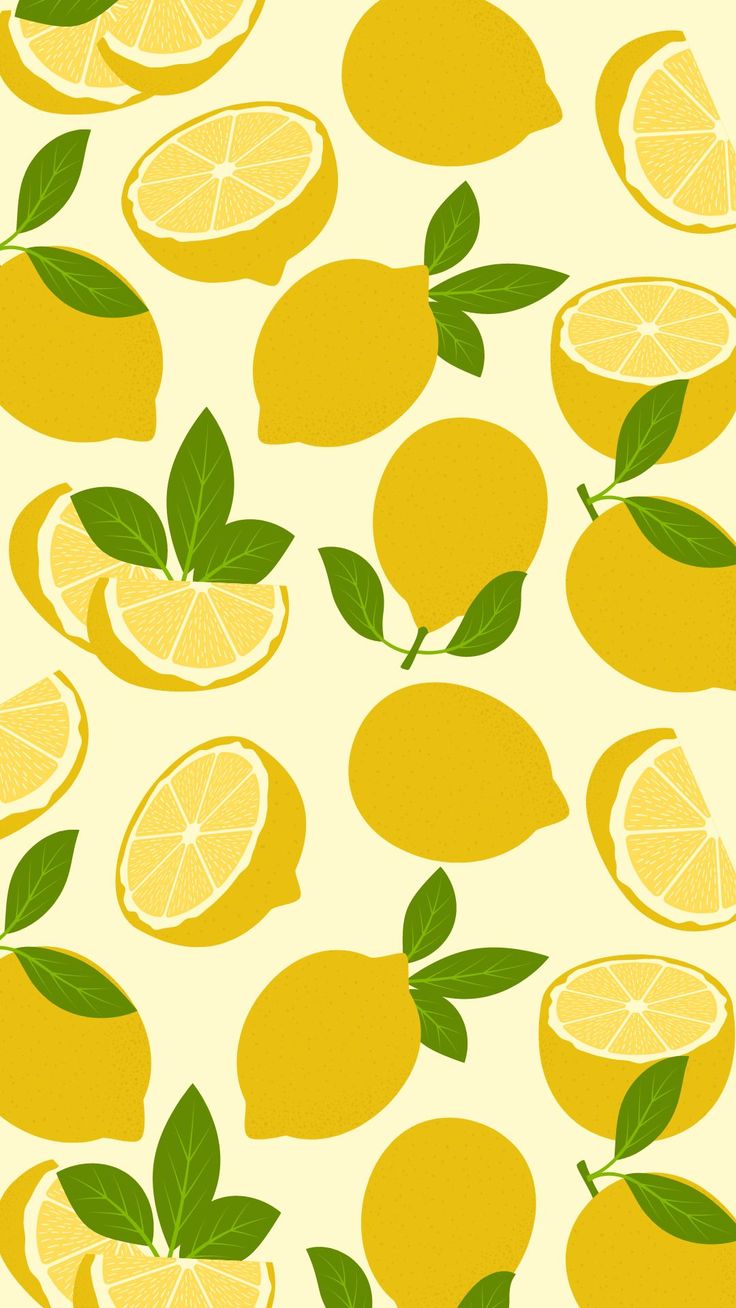 lemons with green leaves on a yellow background