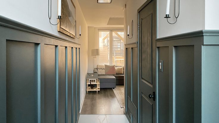 an empty hallway leading to a living room