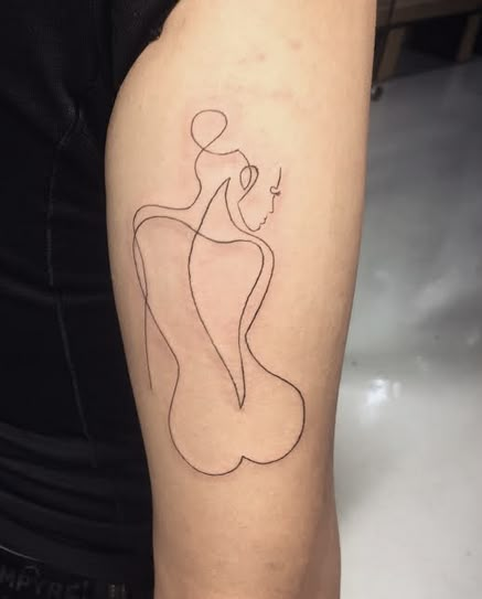 a woman's arm with a line drawing on the left side of her body