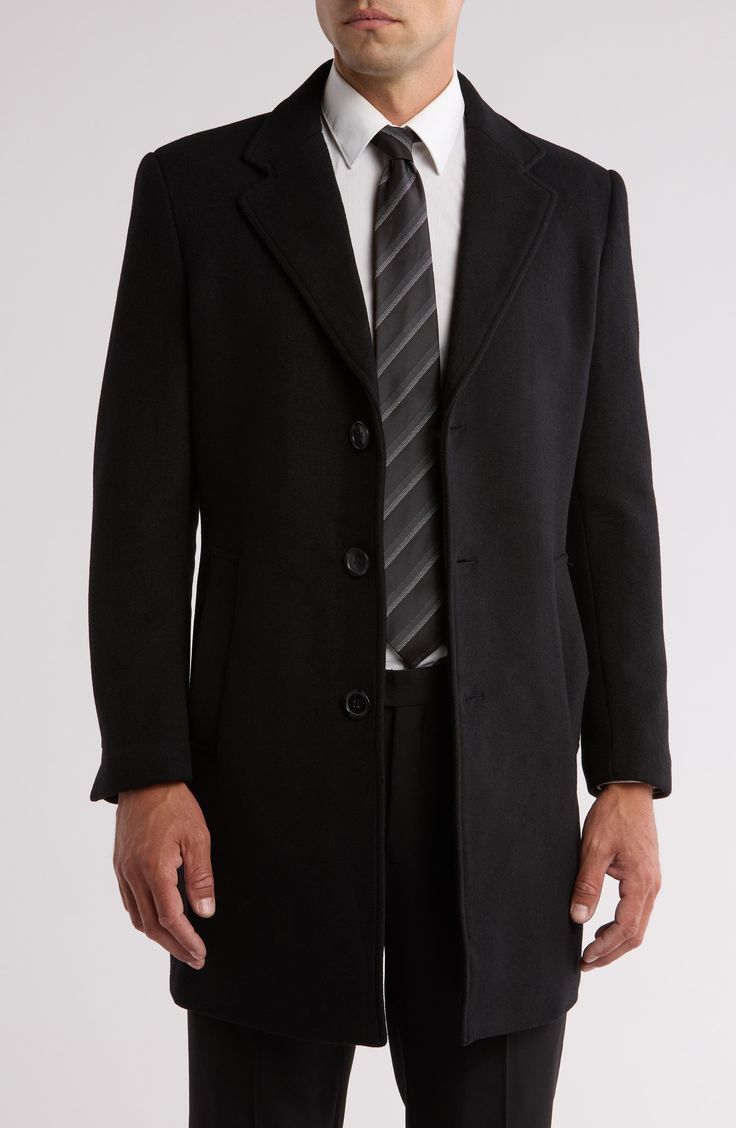 Crisp notched lapels framed a single-breasted jacket cut from a sumptuous wool blend for cool-weather comfort. Front button closure Notched lapels Front welt pockets Back vent Lined 45% polyester, 35% wool, 15% other fibers, 5% nylon Dry clean Imported Tailored Professional Black Outerwear, Black Single Button Business Outerwear, Professional Black Outerwear For Business, Black Notch Lapel Outerwear For Business, Formal Collared Outerwear With Hidden Buttons, Semi-formal Black Outerwear With Hidden Buttons, Semi-formal Single-breasted Outerwear With Lapel Collar, Semi-formal Long Coat With Single Button, Black Professional Outerwear For Formal Occasions